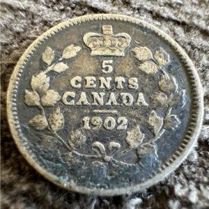 Antique 1902 Canada 5 Cents Coin
This has been in circulation.